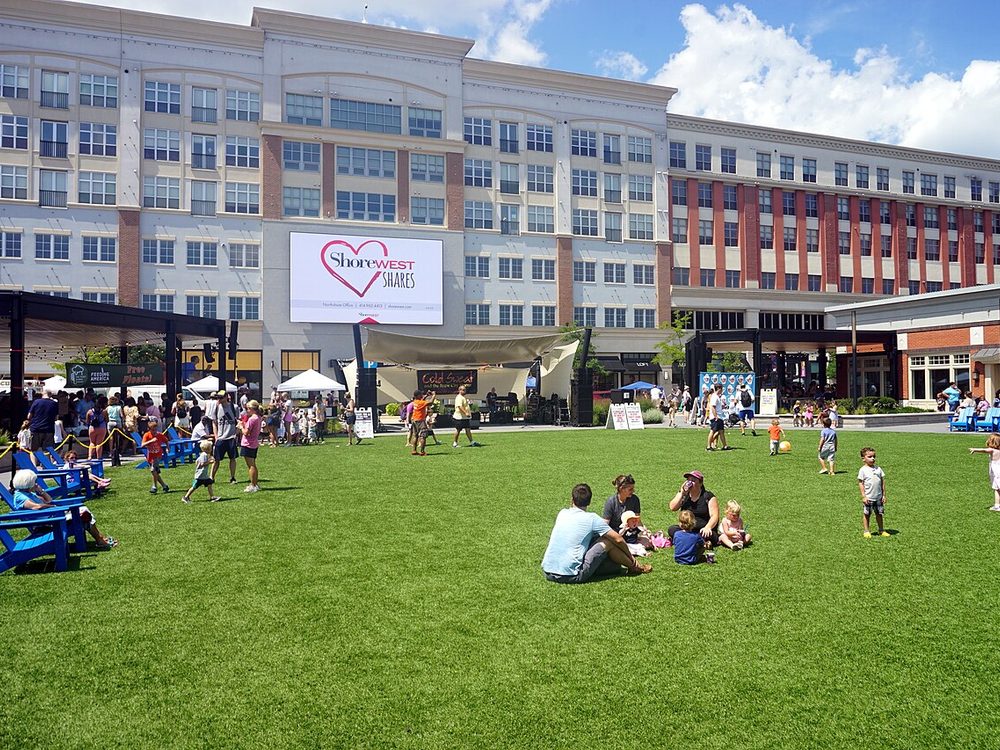 Families on the green at a community event at Bayshore in Glendale